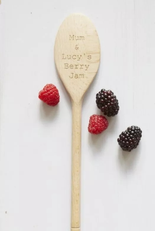 A personalised wooden spoon engraved with 