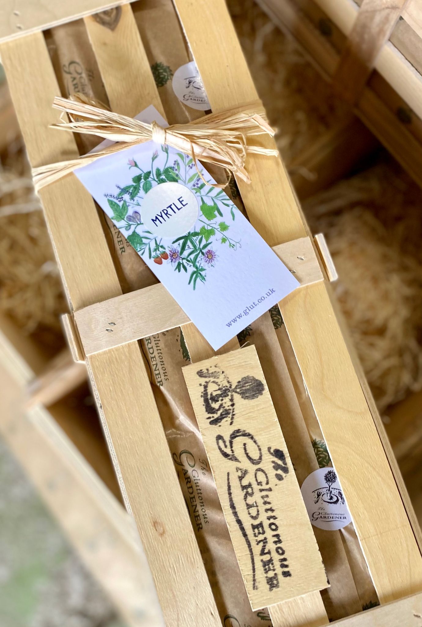 Wooden Myrtle Crate with twine and gift tag.