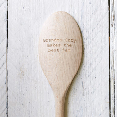 A head of a personalised engraved wooden cooking spoon.