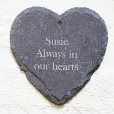 A heart shaped hanging garden slate with a personalised engraving.