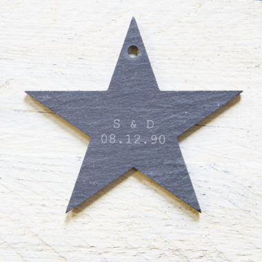 A star shaped hanging garden slate with a personalised engraving.