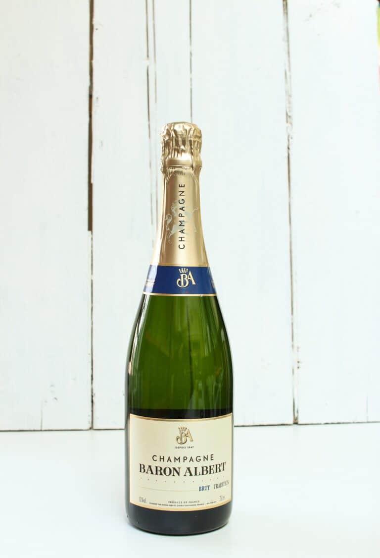 A green full sized bottle of champagne.