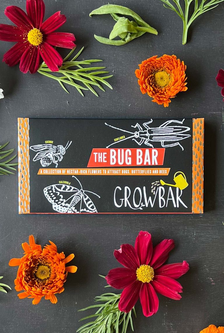 The Bug Growbar on black background displayed with different flowers from the bar.