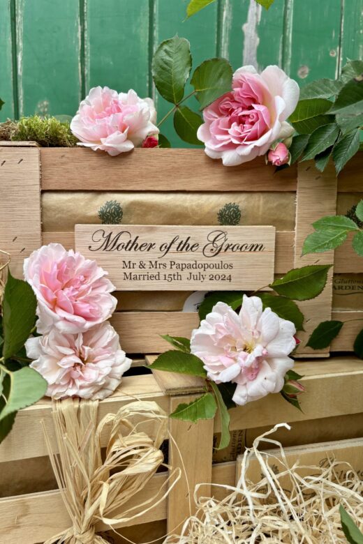 Mother of the groom gift includes a scented pink rose packed in a personalised wooden crate.